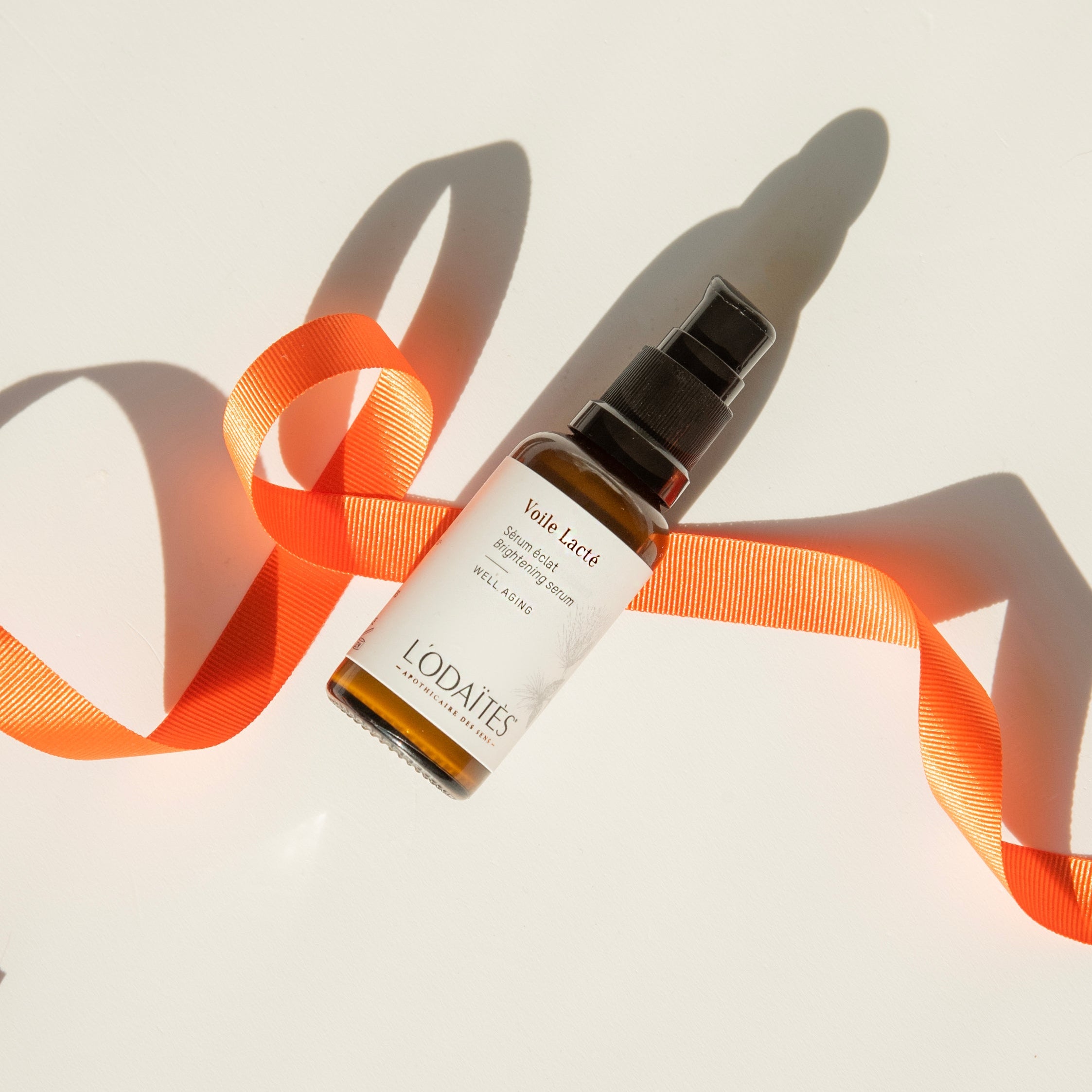 L'Odaïtès brightening serum with orange ribbon