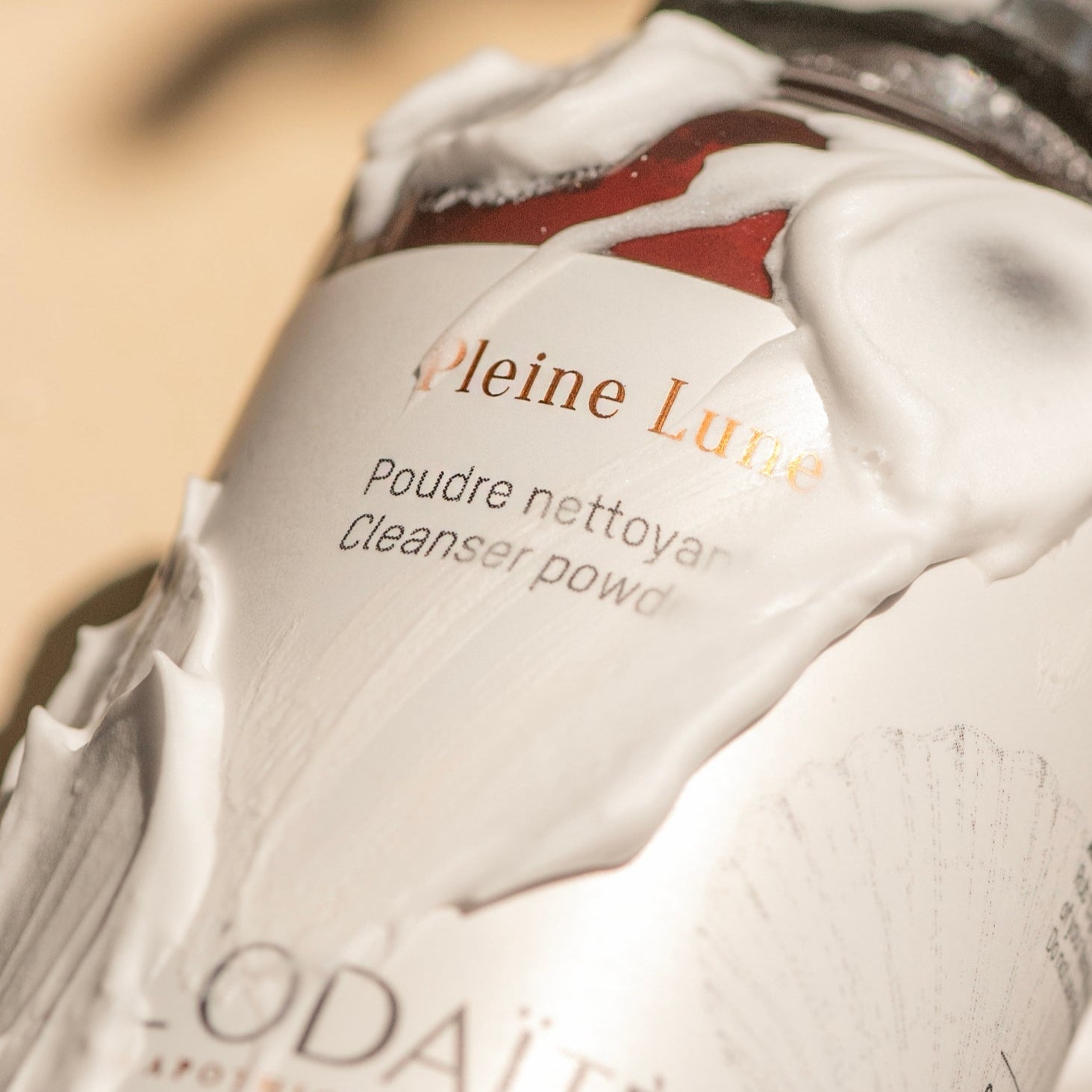 L'Odaïtès cleansing powder foamy texture on the bottle