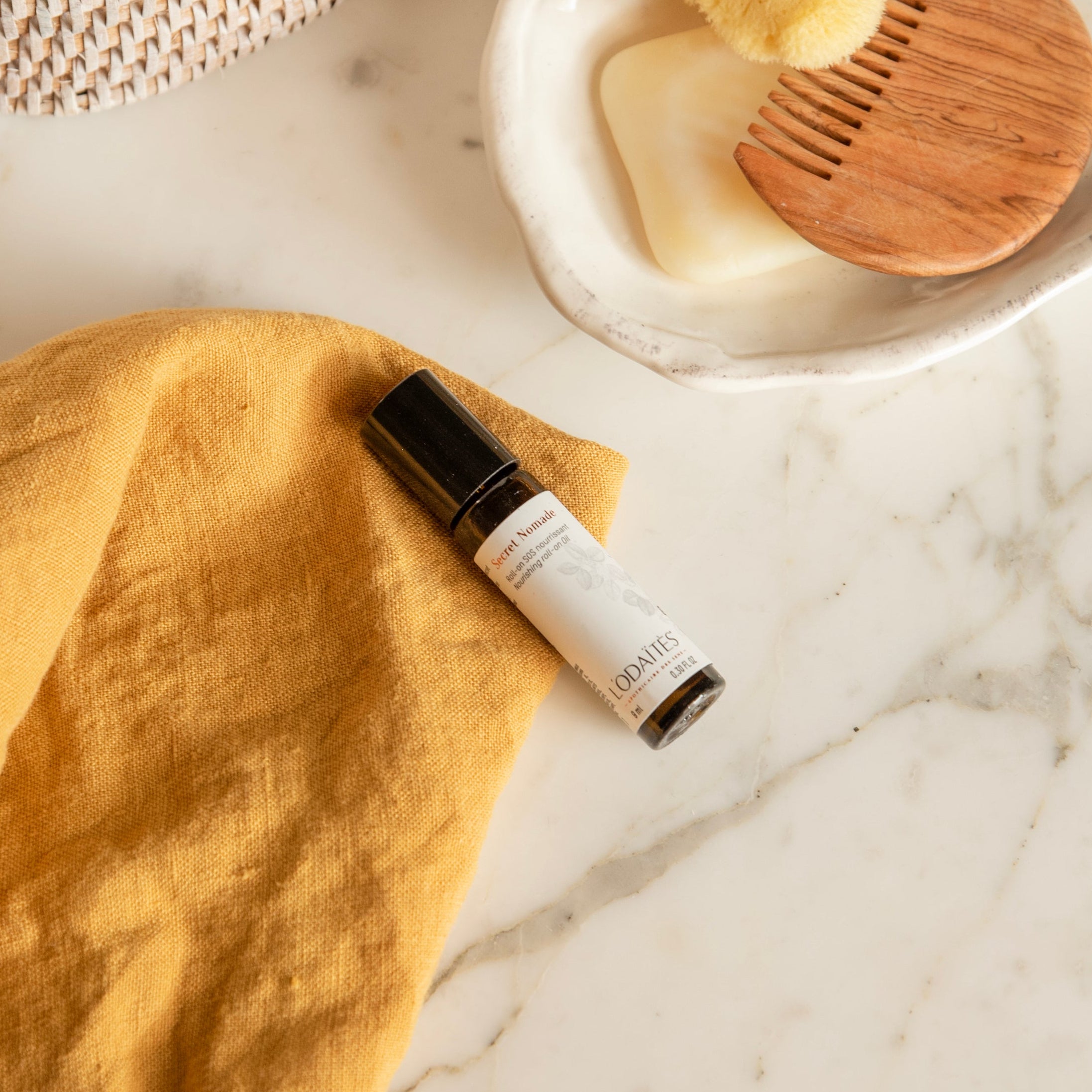 L'Odaïtès nourishing roll-on in a bathroom set-up